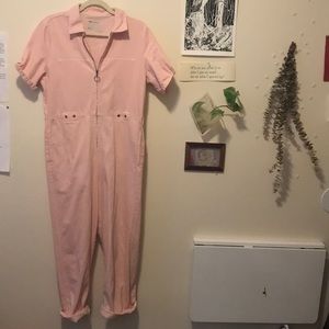ASOS pink denim jumpsuit with O-ring zipper.